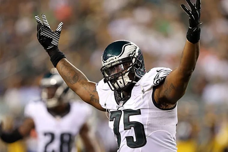 Vinny Curry raises his arms during a preseason game against the Pittsburgh Steelers. (David Maialetti/Staff Photographer)