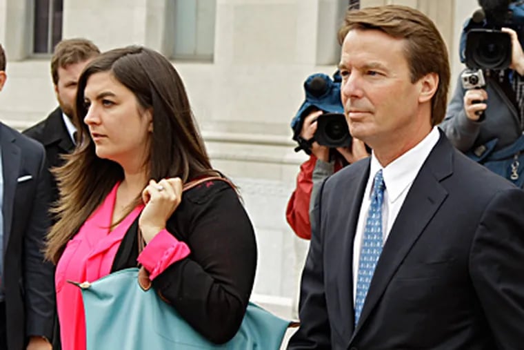 Former Sen. John Edwards leaving federal court in Greensboro, N.C., with his daughter Cate on Monday. He is on criminal trial. CHUCK BURTON / Associated Press