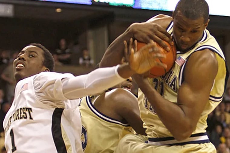 Gani Lawal's, right, early fouls against Duke hurt Georgia Tech. (AP Photo/Rick Havner)