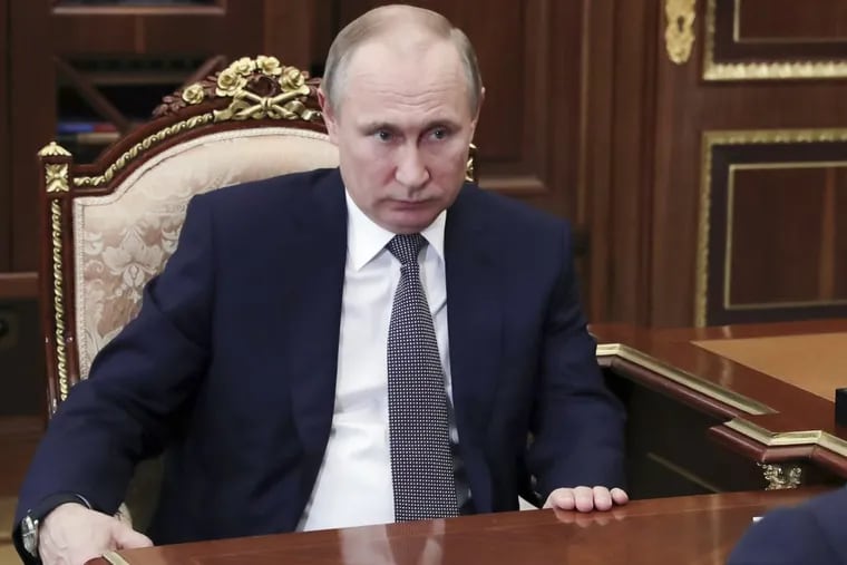 Russian President Vladimir Putin listens during a meeting in Moscow, Russia, Saturday, April 14, 2018. Putin reaffirmed Russia’s view that a purported chemical attack in the Syrian town of Douma that prompted the strike was a fake.
