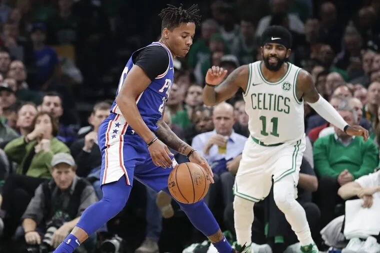 Sixers guard Markelle Fultz steals the basketball during the second-quarter past Boston Celtics guard Kyrie Irving on Tuesday, October 16, 2018 in Boston.