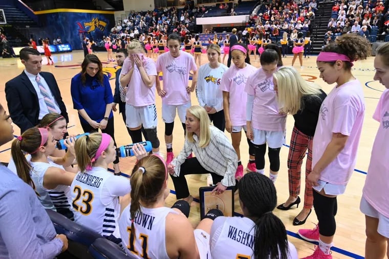 Drexel women's basketball coach Denise Dillon talks to her players during a timeout.
