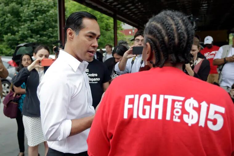 Presidential candidate and former U.S. Department of Housing and Urban Development Julian Castro speaks with a supporter prior to rallying with McDonald's employees and other activists demanding fairer pay, better working conditions, and the right to unionize in Durham, N.C., Thursday, May 23, 2019. (AP Photo/Gerry Broome)