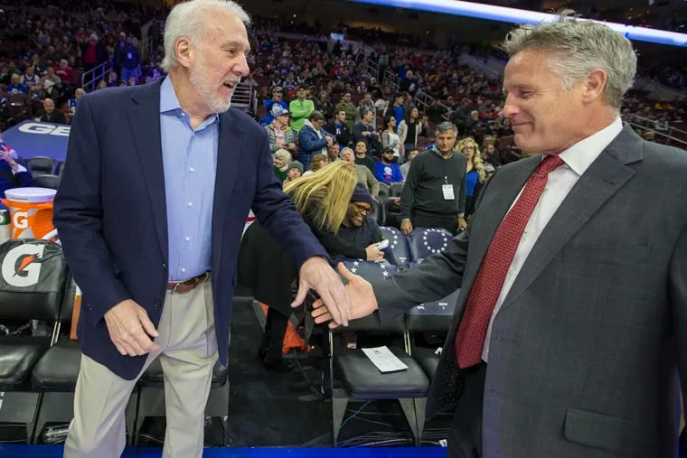 Brett Brown, right, of the Sixers and Gregg Popovich of the Spurs are both members of the NBCA, which released a statement about the death of George Floyd.