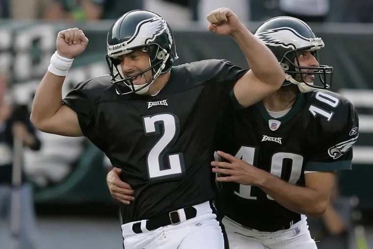 Former Eagles kicker David Akers celebrates his game winning field goal with Koy Detmer. David Akers will join the teamÕs Hall of Fame during the teamÕs matchup against the Washington Redskins on Oct. 31