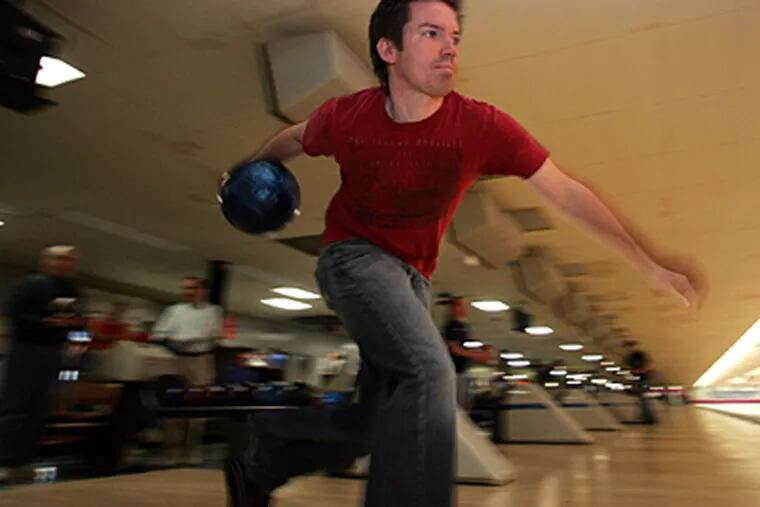 Kevin Vierling Jr., 29, takes aim. He bowls with his father and a brother; four sets of father-and-son bowlers roll in NAF.
