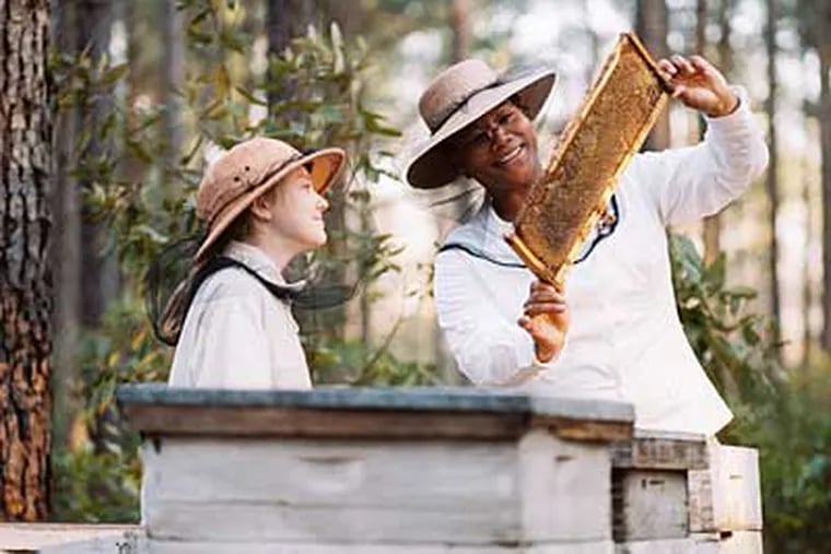 Dakota Fanning and Queen Latifah in "The Secret Life of Bees."