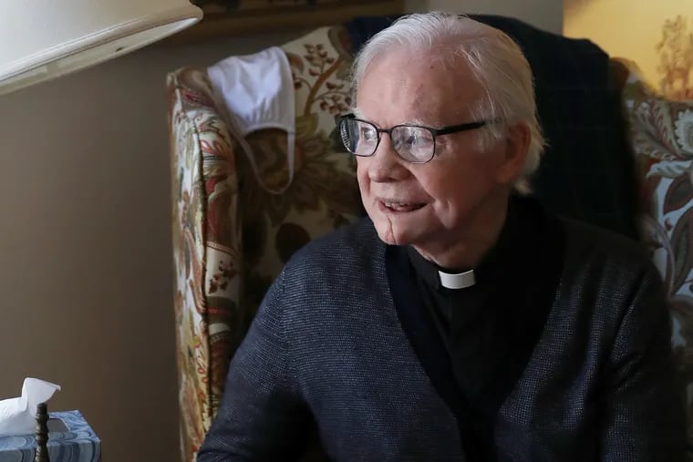 Msgr. Michael Doyle sits for a portrait in his Camden, N.J., home. He retired in July after serving as pastor of Sacred Heart Church in Camden for more than 40 years.