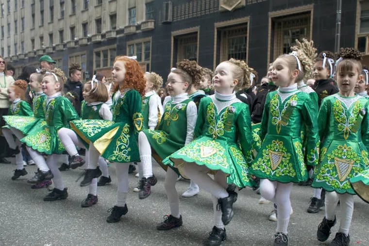 File: Students from The McDade School of Irish Dancing get into the spirit of St. Patrick Day as they prepare to step off into the route of the 2011 parade.
