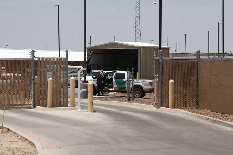A Customs and Border Patrol officer guards the entrance to the Border Patrol station in Clint, Texas, Wednesday, June 26, 2019. The facility has been a hub for detained children in border patrol custody in New Mexico and West Texas since 2014.
