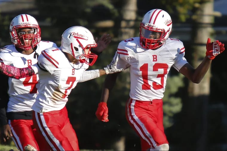 Bristol's Mike Are (13) celebrates with teammates Deon Jackson (4) and Lynn Anthony after scoring on a 65-yard, third-quarter run against Jenkintown.