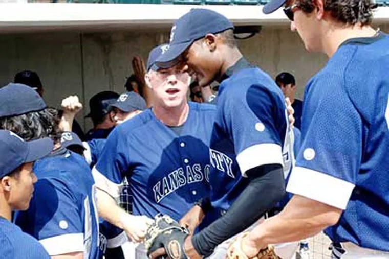 Michael Gaston (center left) and Algenis Perez Soto as the ballplayer nicknamed Azucar (Sugar).