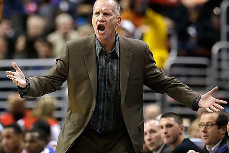Doug Collins argues a call with referee Derek Richardson during the first half of an NBA basketball game against the New York Knicks, Saturday, Jan. 26, 2013, in Philadelphia. (Matt Slocum/AP)