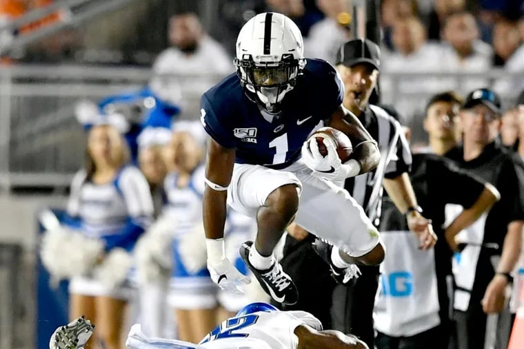 Penn State wide receiver KJ Hamler leaped over a Buffalo defender during Saturday's game.