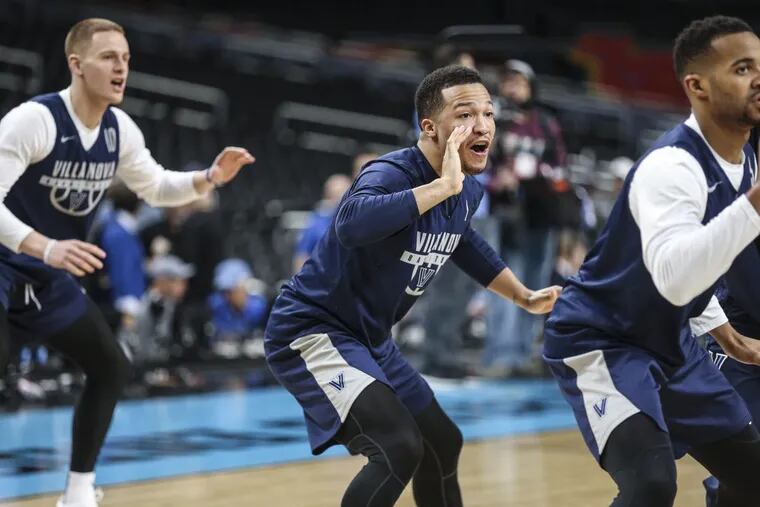 Villanova’s Jalen Brunson (center) warms up with Donte DiVincenzo (left) and Phil Booth during Final Four practice at the Alamodome in San Antonio on Friday.