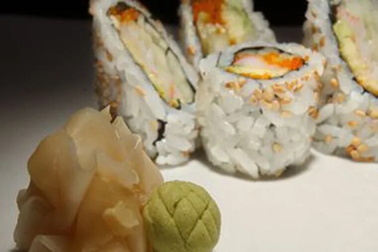 A wasabi and pickled ginger (foreground). Sushi is eaten around the world.