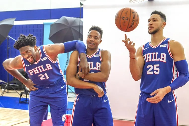 Joel Embiid (from left) Markelle Fultz, and Ben Simmons clown around at the Sixers’ media day on Sept. 25.