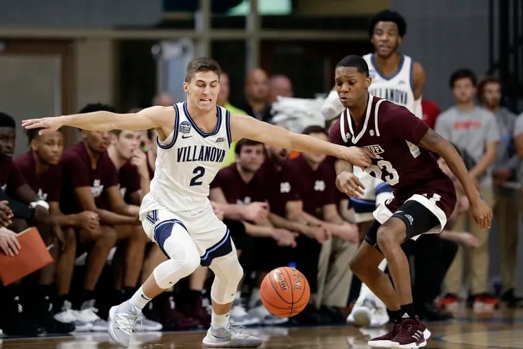 Villanova guard Collin Gillespie (2) and Mississippi State guard Tyson Carter (23) chase the ball during the first half of the Myrtle Beach Invitational semifinals on Friday. Villanova won, 83-76, to move on to its seventh straight title game of a November tournament.
