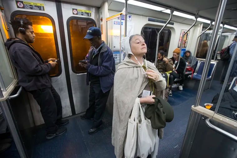 Betsy Ross, played by Carol Spacht, rides SEPTA to work and back from Ambler.  While fully dressed as Betsy she uses her reflection to adjust her bonnet on the Market-Frankford Line.