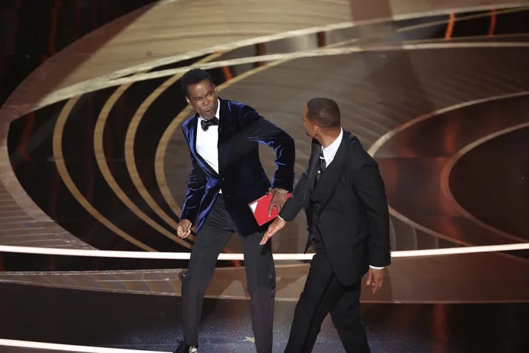 Chris Rock, left, and Will Smith onstage during the 94th Academy Awards at the Dolby Theatre in March 2022.