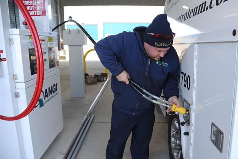 Eric Beavers, a compressed natural gas engineer for Beavers Petroleum Equipment, fills his truck at the River Valley Transit depot. (File photo: Clem Murray / Staff Photographer)
