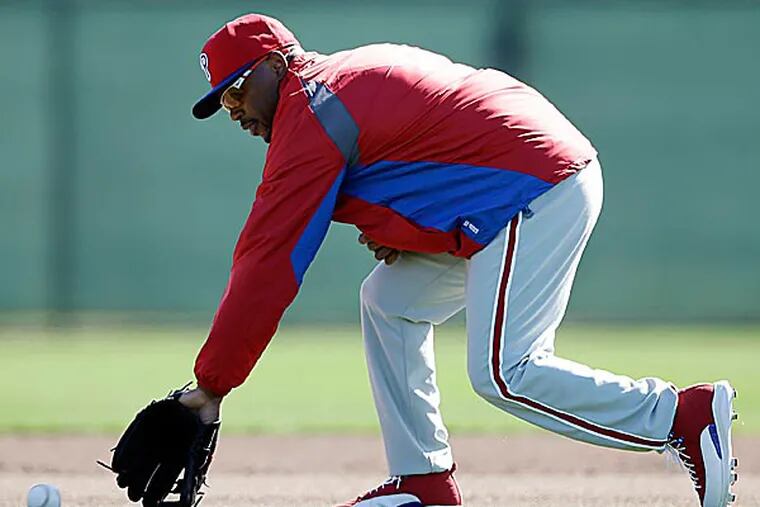The Phillies' Jimmy Rollins chases down a ball during a workout. (Matt Slocum/AP)