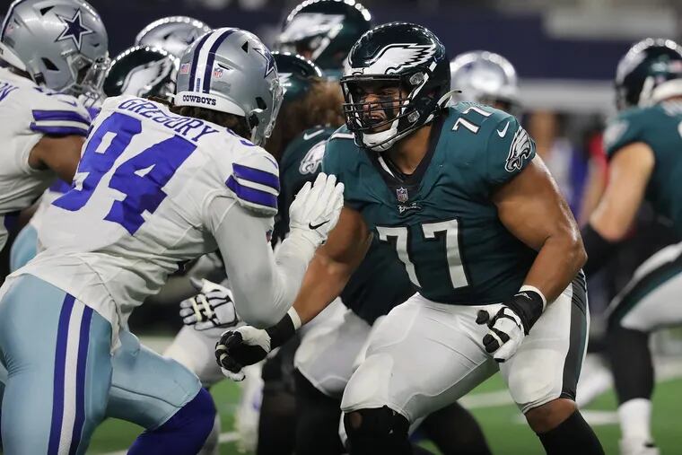 Eagles offensive tackle Andre Dillard (right) moves to block Dallas defensive end Randy Gregory (left) during last week's loss to the Cowboys in Arlington.