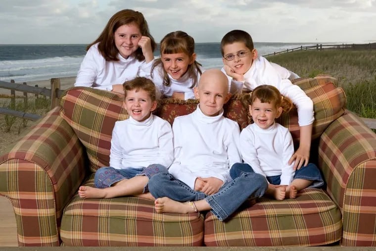 The O’Brien children gather around Catie (front, center). In between radiation and chemotherapy, Catie came home from St Jude Children’s Research Hospital and the family spent a few days at the beach together.