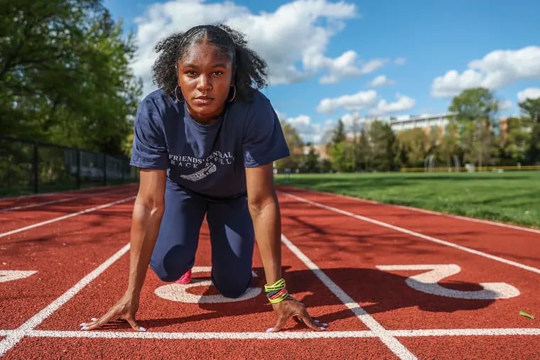 Avery Lewis poses for a portrait on the school track at Friends' Central School in Wynnewood on April 24.