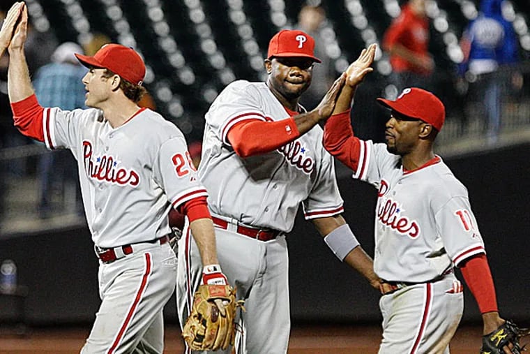 The Phillies' Chase Utley, Ryan Howard and Jimmy Rollins. (Frank Franklin II/AP file photo)