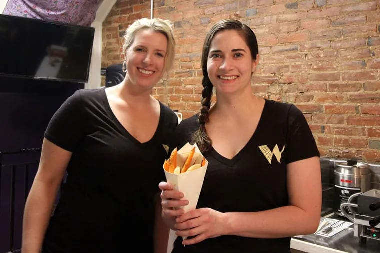 Andrea Capecci (left) and Laura Judy at Waffles & Wedges, 1511 Pine St., in April 2015.