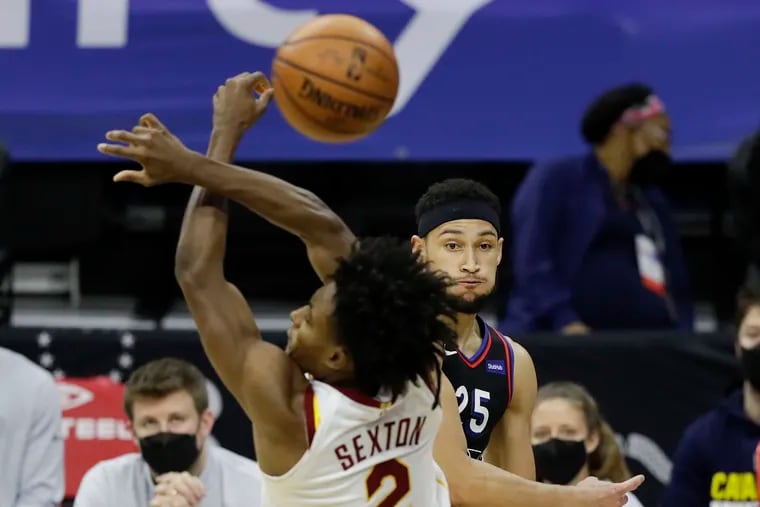 Sixers guard Ben Simmons gets his pass deflected but Cavaliers guard Collin Sexton.