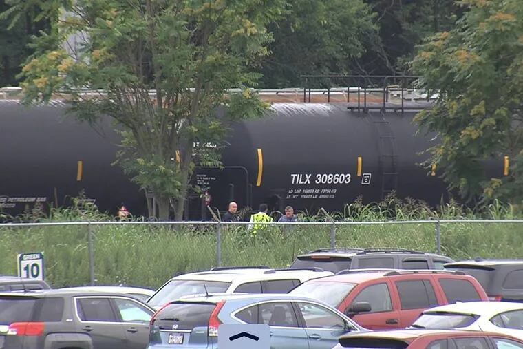 Investigators at the scene where an 8-year-old boy was hit by a freight train.