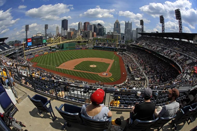 Baseball fans watch a baseball game between the Pittsburgh Pirates and the Cincinnati Reds at PNC Park in Pittsburgh, Sunday, June 17, 2018. The Reds won 8-6.