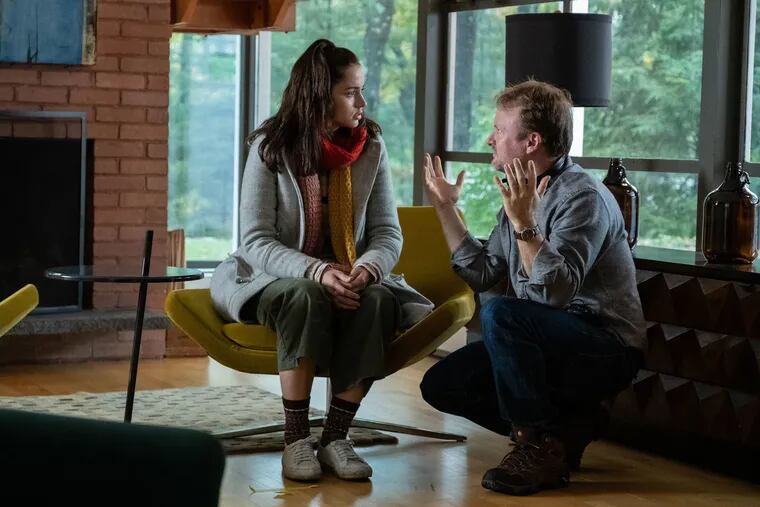 Director Rian Johnson talks to actor Ana de Armas on the set of "Knives Out."