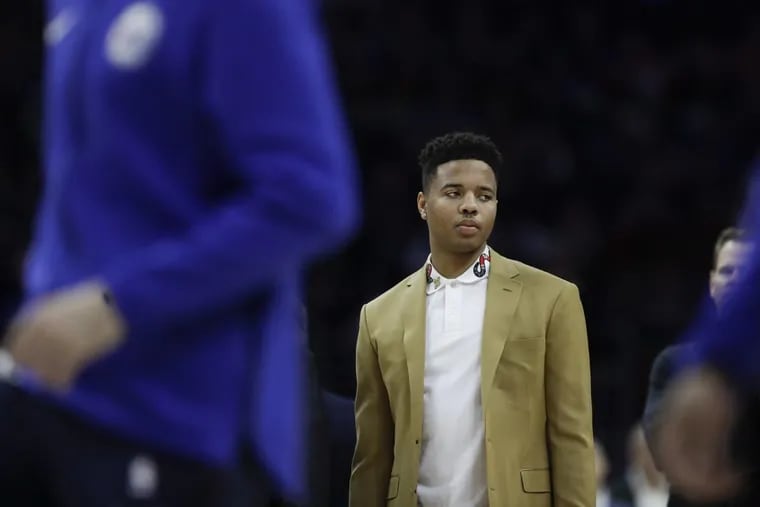 Sixers guard Markelle Fultz watches pregame warm-ups before the Sixers play Milwaukee Bucks on Saturday, January 20, 2018 in Philadelphia.