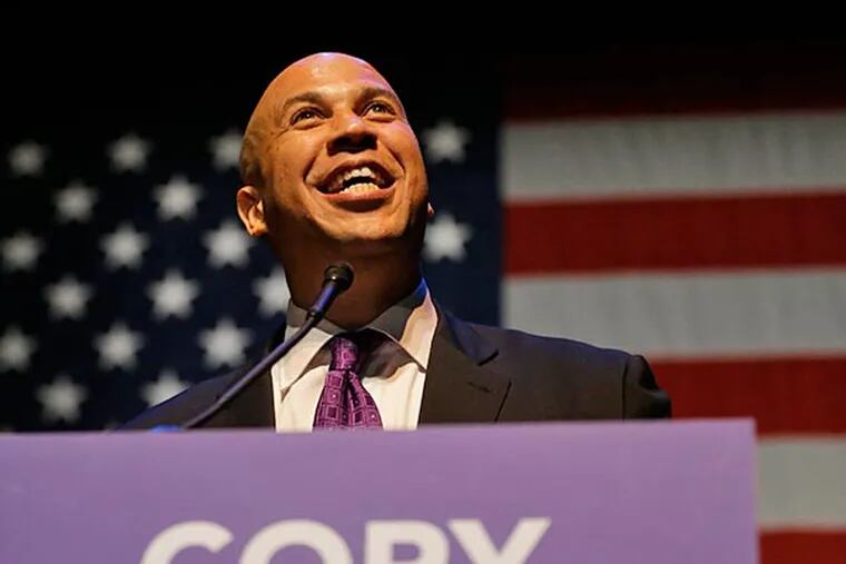 Newark Mayor Cory Booker talks to supporters during an election night victory party after winning a seat in the U.S. Senate, Wednesday, Oct. 16, 2013, in Newark, N.J. Booker and Republican Steve Lonegan faced off to fill the U.S. Senate seat left vacant by the death of Sen. Frank Lautenberg. (AP Photo/Julio Cortez)