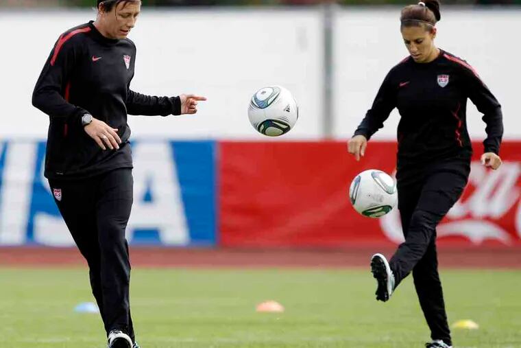 U.S. team members Abby Wambach (left) and Carli Lloyd will be trying to bring home America's third Women's World Cup on Sunday when they take on Japan in the championship match.