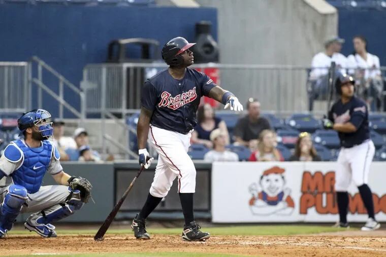 Ryan Howard, here playing for the Gwinnett Braves, watches a two-run home run on May 3, 2017. Howard is trying to regain a spot in a major-league lineup.
