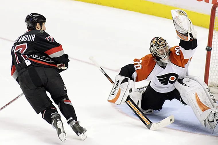 Flyers goalie Antero Niittymaki stopping Carolina's Rod Brind'Amour in a 2008 game. Brind'Amour starred for the Flyers from 1991-92 until  being traded to Carolina during the 1999-2000 season.