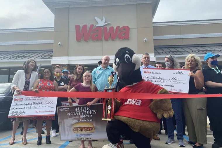 A ribbon cutting is held at the new Wawa at 418 W. Baltimore Pike, Upper Darby, on Thursday. At center, holding the "Mare of Easttown" sign, is Bucks County actress Kassie Mundhenk, who stars in the show. Behind her is Chester County Detective Christine Bleiler, who was Kate Winslet's local "go-to person" for character advice and inspiration.