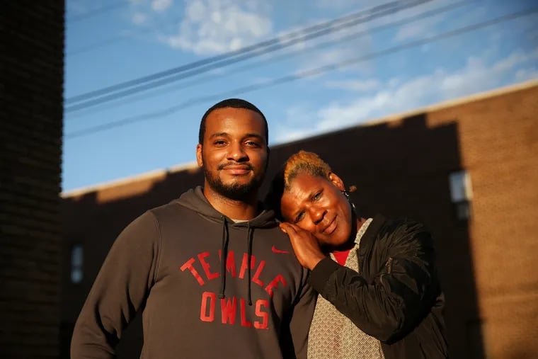 Hazim Hardeman, left, and his mother, Gwendolyn, stand for a portrait outside their West Philadelphia apartment on Tuesday, Sept. 18, 2018. Hazim Hardeman is Temple University's first Rhodes Scholar. TIM TAI / Staff Photographer