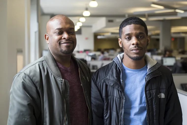 Shawn Yarbray (right) and his father, Karif Roberts, in the newsroom of the Inquirer and Daily News, where they were interviewed Monday, April 2, 2018, four days after Yarbray was acquitted of attempted murder and robbery of City Councilman David Oh.