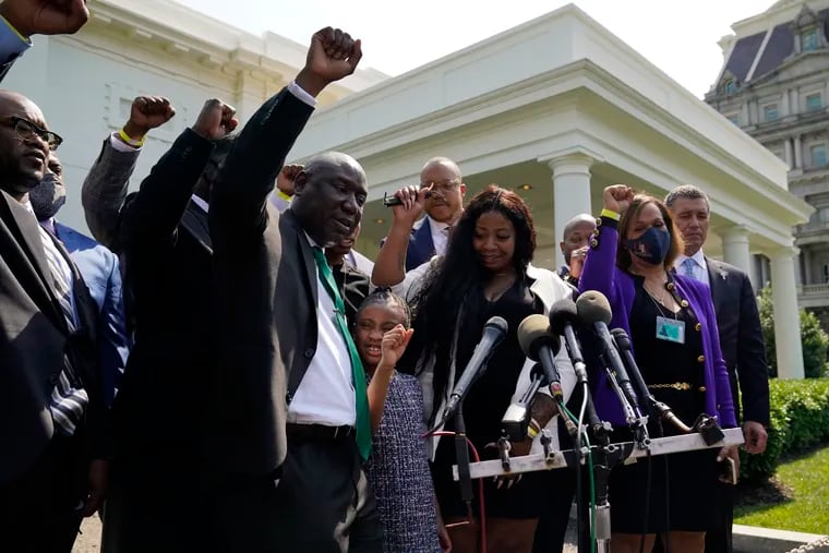 Benjamin Crump, front center, along with Gianna Floyd, daughter of George Floyd, and her mother Roxie Washington, and others talk with reporters after meeting with President Joe Biden at the White House, Tuesday, May 25, 2021, in Washington. (AP Photo/Evan Vucci)