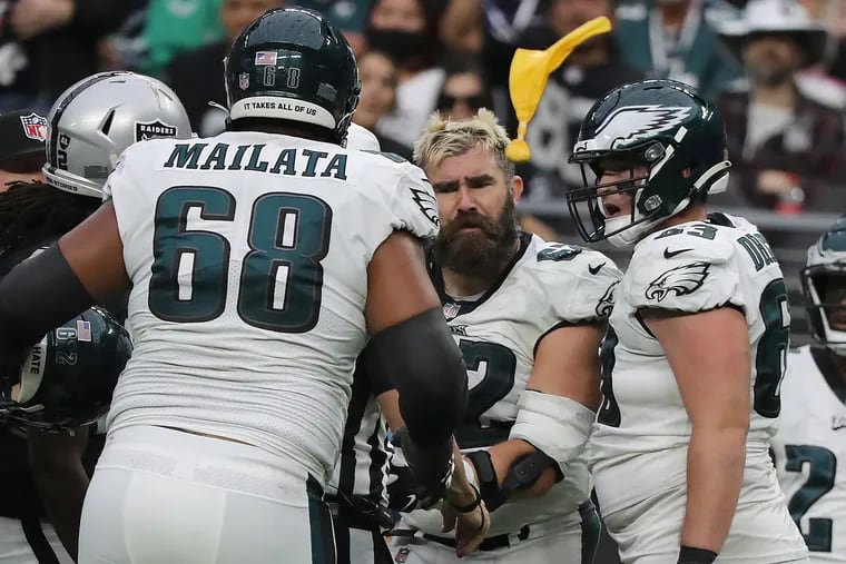 Eagles center Jason Kelce (center) is flagged in the third quarter during Sunday's game against the Las Vegas Raiders.