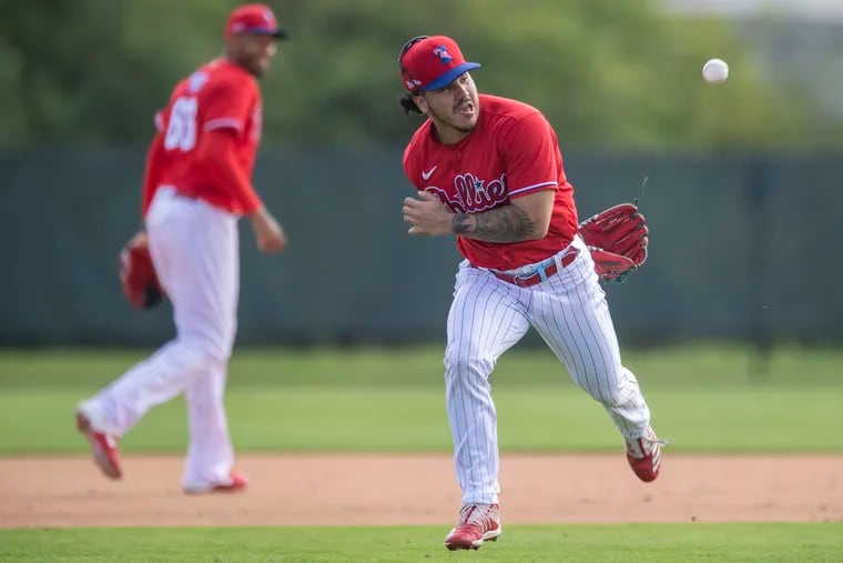 Phillies reliever JoJo Romero fields a ground ball during a spring-training practice last month in Clearwater, Fla. Romero was optioned to minor-league camp Sunday.