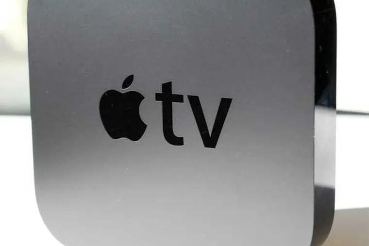 The Apple TV was originally released in 2007 then again in 2010, shown here. The device grabs movies and TV show rentals from the Internet and displays them on a TV. (AP Photo/Mark Lennihan)