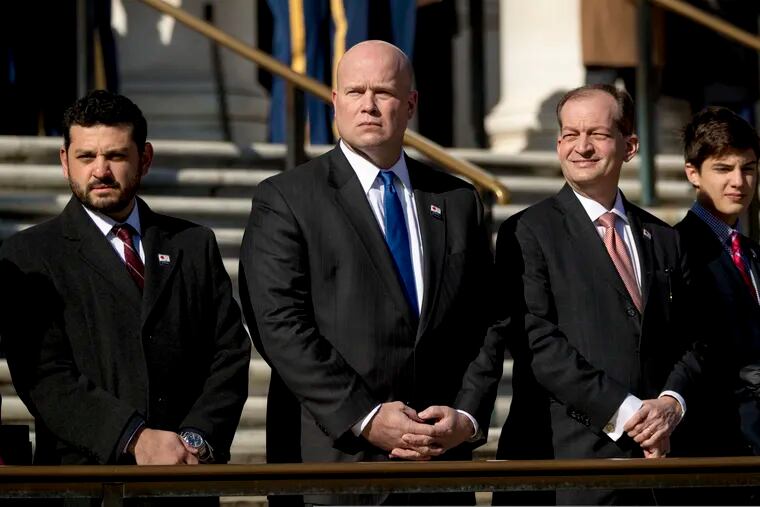 Acting United States Attorney General Matt Whitaker (center) and Labor Secretary Alex Acosta (second from right) attend a wreath laying ceremony at the Tomb of the Unknown Soldier at Arlington National Cemetery on Sunday.