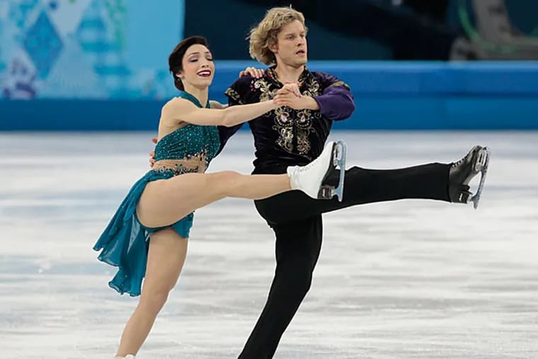 Meryl Davis and Charlie White of the United States compete in the team free ice dance figure skating competition at the Iceberg Skating Palace during 2014 Winter Olympics, Sunday, Feb. 9, 2014, in Sochi, Russia. (Ivan Sekretarev/AP)