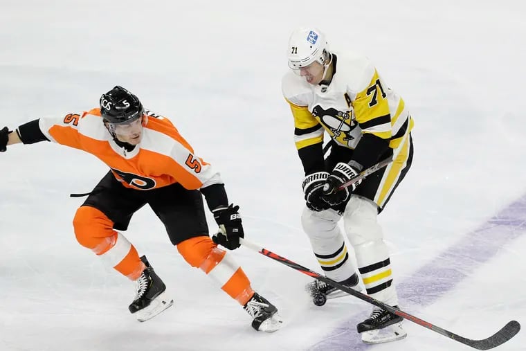 Flyers defenseman Phil Myers defends Pittsburgh Penguins center Evgeni Malkin in a Jan. 13 game. Myers is close to returning after fracturing a rib Jan. 19 against Buffalo.